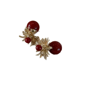 Fireworks starburst earrings with red pearls in a vintage gold-toned luxury design