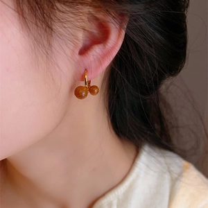 Maillard tiger eye stone gold hoop earrings with dual round beads on female model