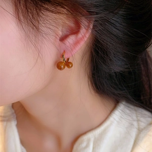 Elegant gold tiger eye bead hoop earrings shown on model for a minimalist vintage look