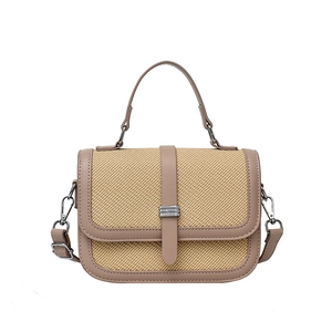 Retro patchwork handbag with beige straw texture and rose pink faux leather accents