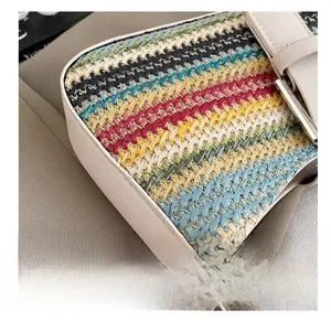Detail show of colorful woven straw bag texture with beige leather strap and hardware