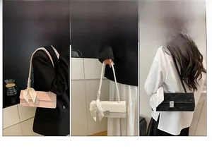 Three baguette bags in pink, white, and black with floral silk scarf detail and metal buckle