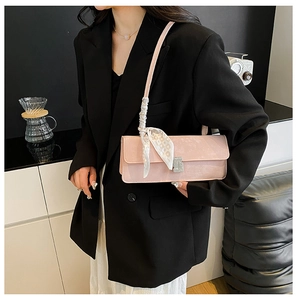 Pink shoulder bag with silver buckle and black-white checkered silk scarf detail