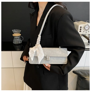 Shoulder bag in light grey leather with rhinestone buckle and heart scarf detail