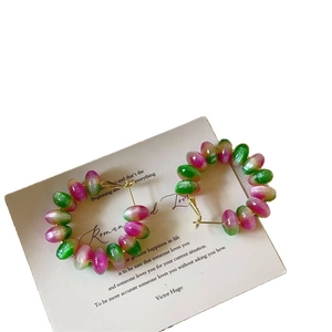 Pink and green beaded hoop earrings with cat-eye gemstones on minimalist gold rings
