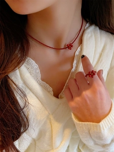 Detailed view of handmade deep red Czech bead floral necklace and ring jewelry set