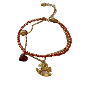 Double-layered red rope and gold chain bracelet with heart gem and rocking horse charm