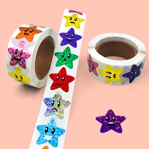 Roll of holographic star reward stickers with cartoon faces for gift decoration
