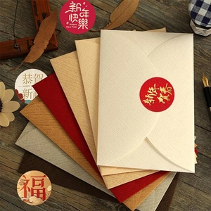 Detail of vintage Lunar New Year stickers and paper envelopes with festive greetings
