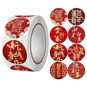 Detail of red and gold Lunar New Year round stickers with Chinese zodiac dragon motifs