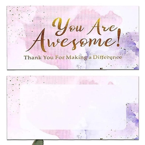 Macro detail of watercolor reward cards with golden text and blank writing back area