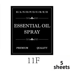 Detail view of five black waterproof essential oil spray bottle label stickers