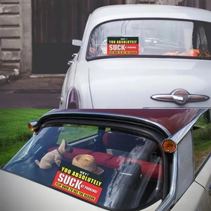 Detail of yellow Bad Parking cards displayed on a car windshield and rear window