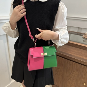 Fashionable color-block Kelly bag in pink and green with a golden buckle for women