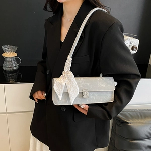 Chic silver shoulder bag with rhinestone buckle and heart pattern scarf detail