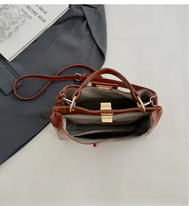 Detailed view of brown crocodile texture leather interior with organized compartments