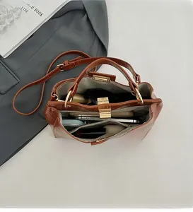 Internal view of brown crocodile texture handbag showing large capacity for essentials