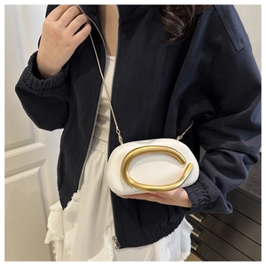 White PU leather crossbody bag with oversized gold C-shaped metal link and chain strap