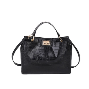 Classic black crocodile pattern handbag with elegant gold square lock and handle