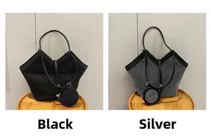 Detail of studded tote bag set in black and silver with round pendant coin purse