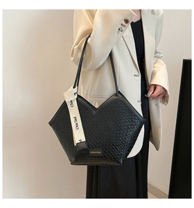 Close-up of black woven texture tote bag featuring a unique V-shaped opening design