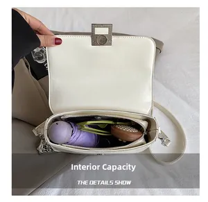 Internal capacity of white PU leather shoulder bag with umbrella and sunglasses