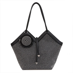Black tote bag with silver rhinestones and matching round coin purse on white background