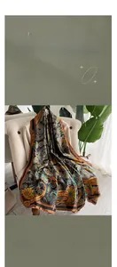 Macro detail of retro paisley faux silk scarf with elegant golden patterns on black fabric