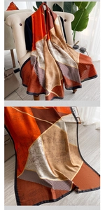 Detail of elegant geometric silk scarf with houndstooth pattern and premium draping effect
