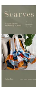 Artistic wave print silk-like scarf draped on sofa with chic sunglasses and green plants