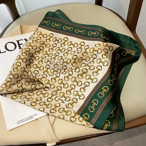Classic 70x70 square silk scarf featuring golden horsebit chains and green borders