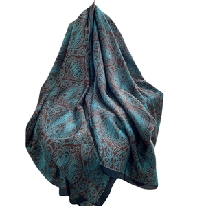 Blue-green paisley totem silk scarf and shawl for women on white background
