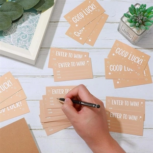 Macro view of beige raffle tickets and Good Luck cards on a wooden background