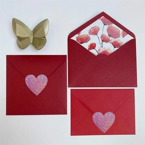 Pink holographic heart stickers on red envelopes with floral liners for Valentines Day