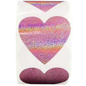 Roll of holographic pink heart stickers for Valentine packaging and gift decoration