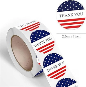 Detail showing a 1-inch roll of USA flag Thank You stickers for gift packaging