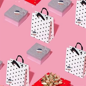 Macro detail of Thank You stickers with US flag on gift boxes and paper bags