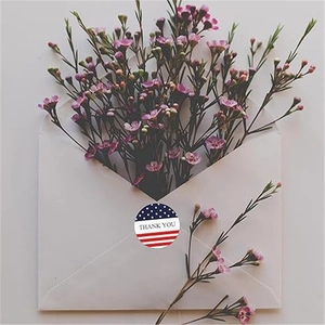 US Flag round thank you stickers on white envelopes with decorative pink flowers