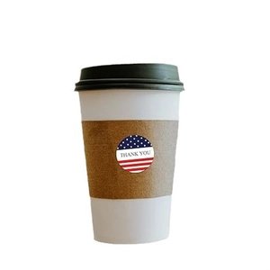 Round USA flag Thank You seal sticker on a brown corrugated coffee cup sleeve