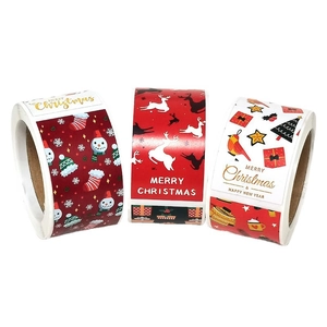 Roll of square Christmas stickers with Santa, reindeer and festive patterns