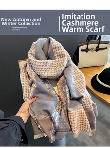 Close-up of houndstooth scarf texture with fringe detail in blue and beige