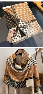 Detail of cashmere-like scarf showing houndstooth patterns and elegant fringe edges