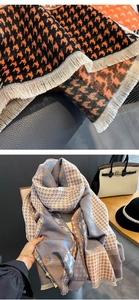 Detailed view of houndstooth scarf texture and soft fringe in multiple colorways