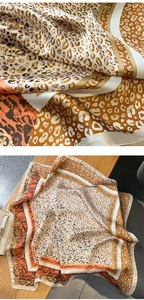 Detail eines Satin-Halstuchs mit Leopardenmuster in elegantem Orange und Braun Spleißing