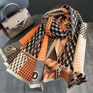 Houndstooth cashmere-feel scarf with orange and black stripes and tassel fringe