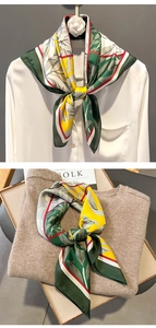 Close-up of elegant floral print silk scarf styled on a shirt and flat lay setup