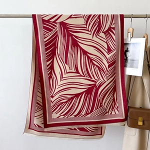 Elegant deep red and beige faux cashmere shawl with abstract palm leaf pattern and tassels