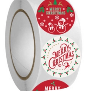 Roll of Merry Christmas stickers with snowman and reindeer for gift decoration