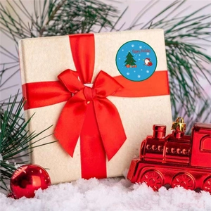 Round Happy Holiday stickers with Santa and Christmas tree on a gift box with red ribbon