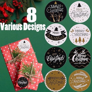 Close-up of eight round Christmas roll stickers featuring festive trees and reindeer horns